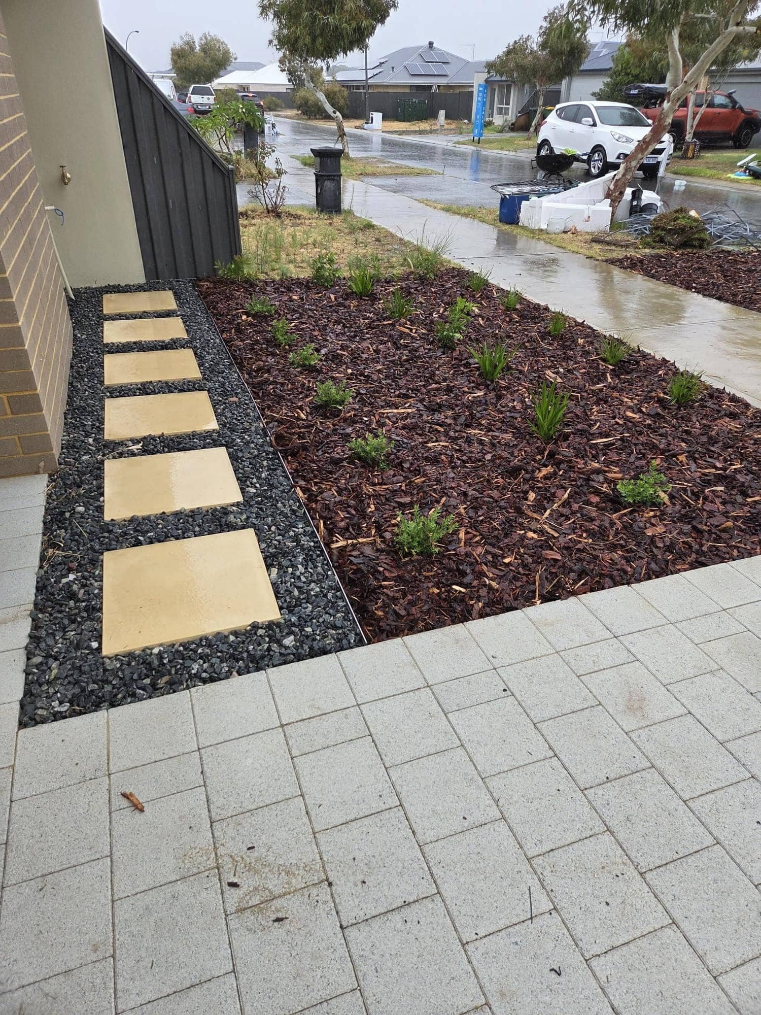Front yard steppers, gravel path and mulch beds